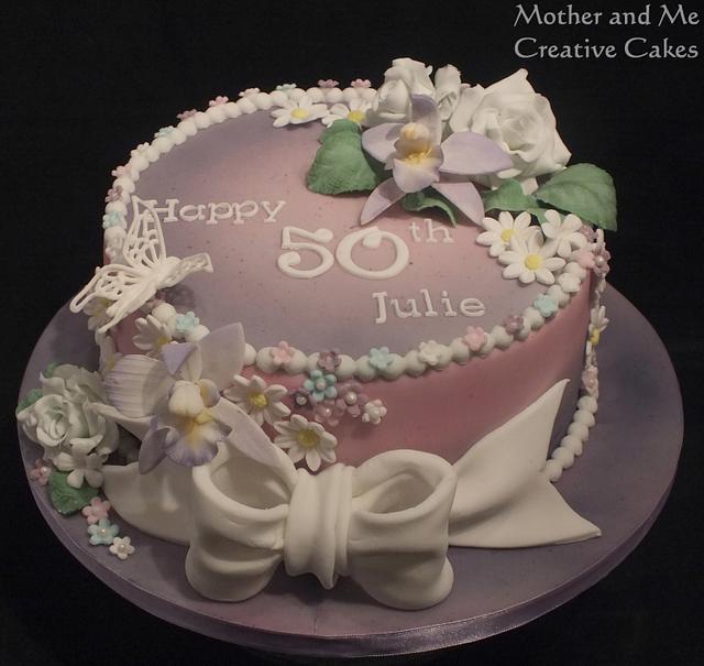 Floral 50th - Decorated Cake by Mother and Me Creative - CakesDecor