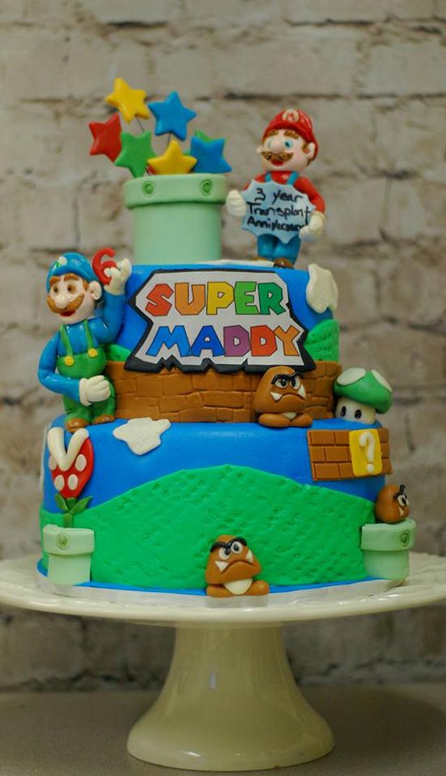 Super Mario Cake - Decorated Cake by Cakes Abound - CakesDecor