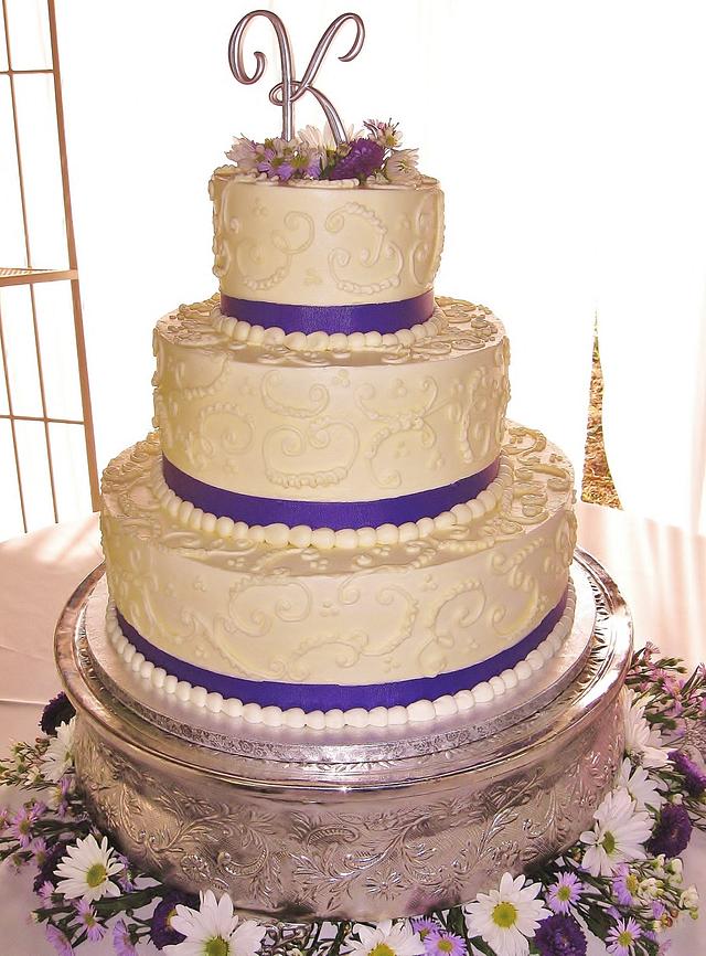 Buttercream tiered scrollwork wedding cake