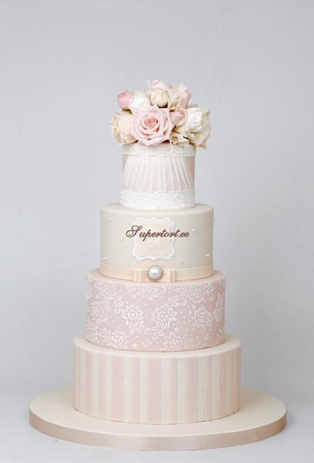 Romantic three tiered wedding cake, with pastel pink rose flowers, on a  gold stand. Hand painted Rococo style with intricate icing and white  background. Tapestry by Jane Rix - Jane Rix -