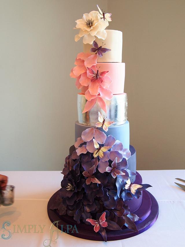 Falling petals wedding cake with butterflies