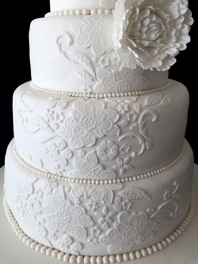 White peony and lace wedding cake