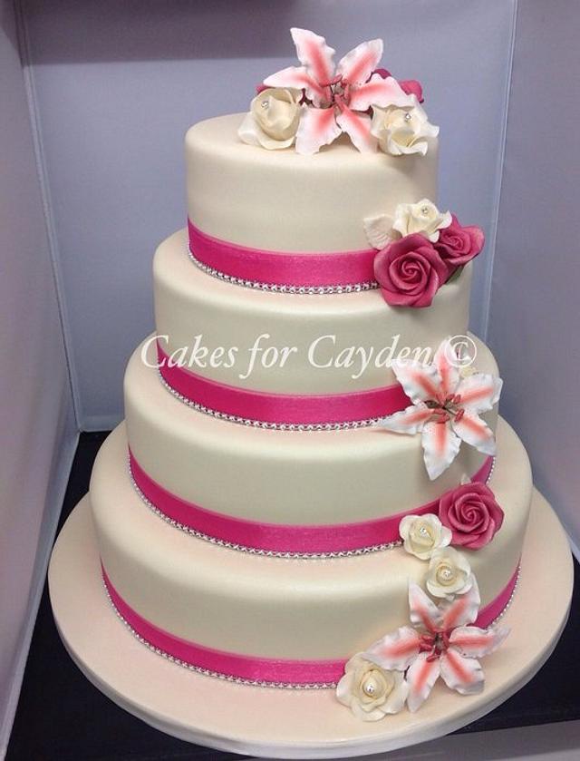 Stargazer Lillie's and Roses Wedding Cake - Decorated - CakesDecor