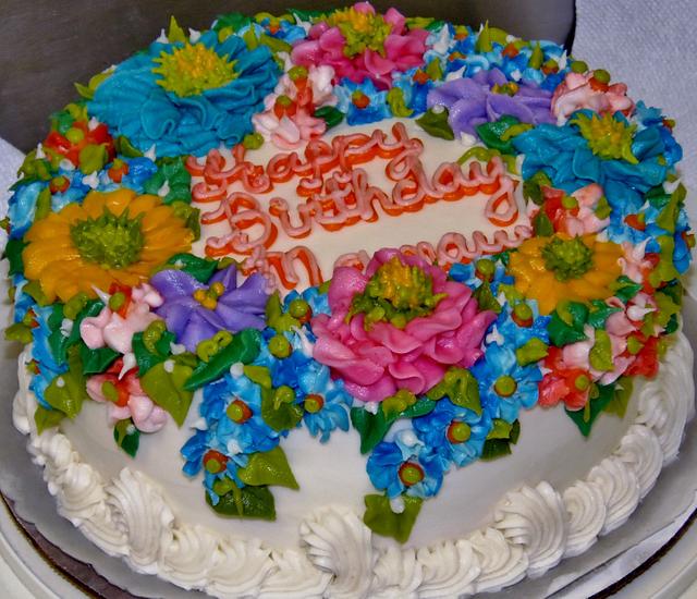 Buttercream cake with aray of flowers