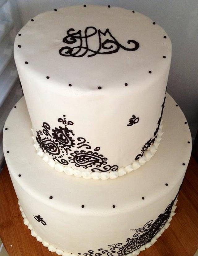 Henna, yoga, guitar design wedding cake