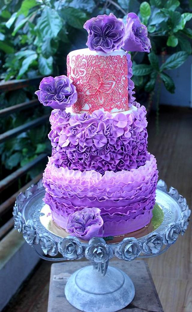 rosettes and English cabbage roses in ombre represents the bride’s charm, e...
