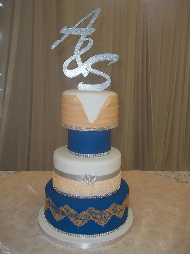 Royal blue and peach wedding cake - cake by Willene Clair - CakesDecor