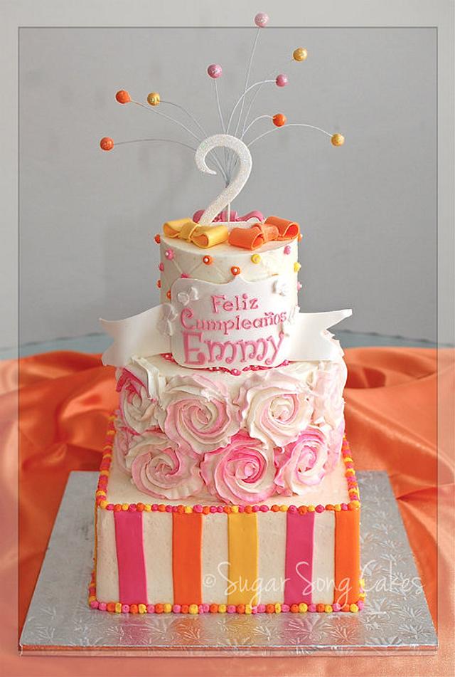 Rosettes and Ribbons Birthday Cake - Cake by lorieleann - CakesDecor