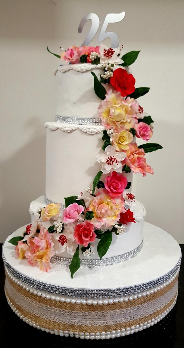 Floral cascade Decorated Cake by Santis CakesDecor
