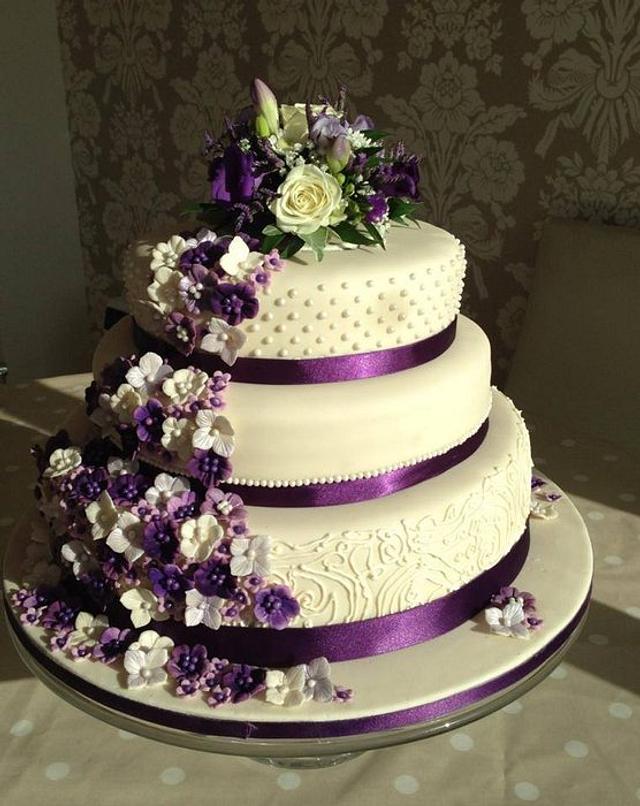 purple flower wedding cake - Decorated Cake by Samantha - CakesDecor