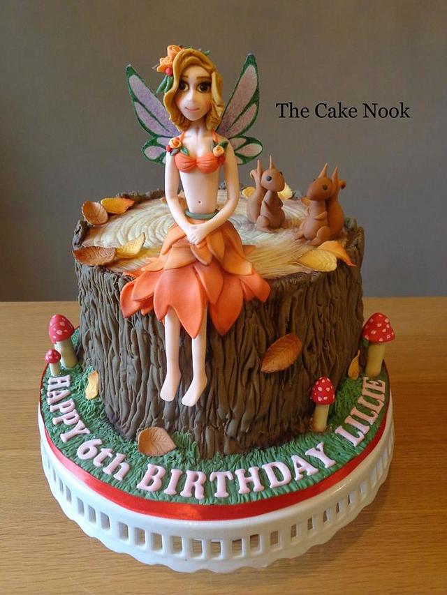 Fairy tree stump cake. - Decorated Cake by Zoe White - CakesDecor