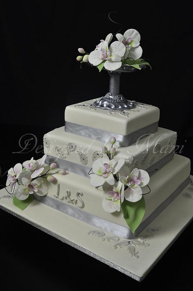 wedding cake with moth orchids Cake by designed by mani CakesDecor