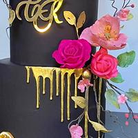 Black wedding cake with sugar flowers