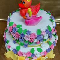 Cake with ducks and flowers