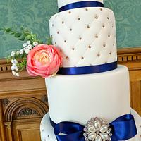 5 tiered coral and navy wedding cake