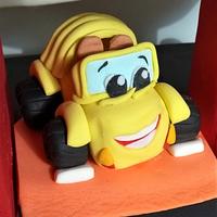 Yellow cabriolet cake topper.