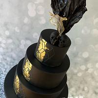 Black & gold, skull topped wedding cake