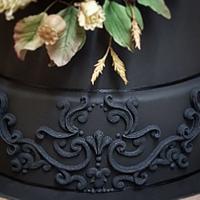 Black wedding cake with dried flower effect sugar flowers