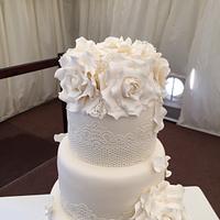 Cream roses and lace  wedding cake 