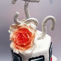 Wedding cake with bride and groom pictures