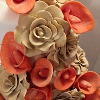 Autumn champaign rose and orange lilly wedding cake 