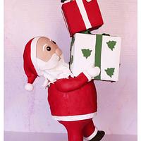 Anti gravity Santa carrying parcels cake.