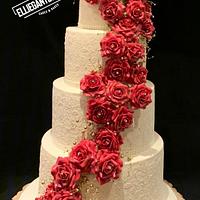 Lace wedding cake with handmade rose cascade