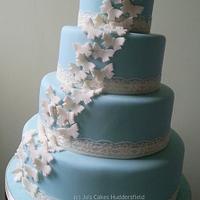 Wedgwood Blue 4 Tier Wedding Cake with Ivory Butterflies