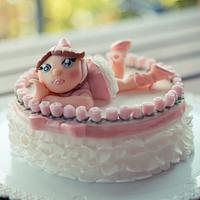 Ballerina resting on her tutu cake
