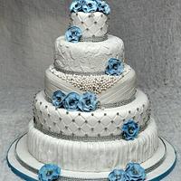 Vintage wedding cake with beads,lace, quilting, drapes and flowers
