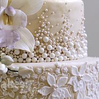 Classy 80th pearls, lace and orchids
