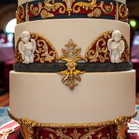 Ornate wedding cake with faux stand