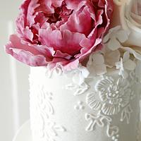 Wedding cake with roses and peonies