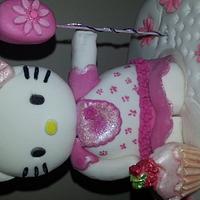 Hello Kitty with flower balloon and lil cupcake