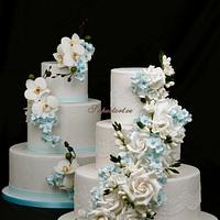 2 cakes with sky blue flowers
