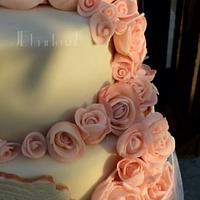 Wedding cake with lots of pink marzipan roses