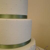 Piped swiss dots wedding cake