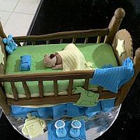 the baby in the crib cake