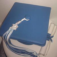 Blue and white graduation cake