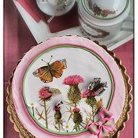 Cake with thistles and insects