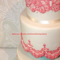 Coral and ivory coloured wedding cake