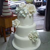 Wedding cake white roses and hydrangea