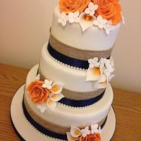 Hessian, navy and orange roses and call lillies