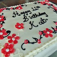 Buttercream cake with coral fondant flowers