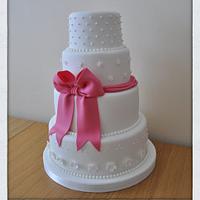 Pink bow wedding cake 
