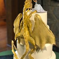Gold Dragon climbing up a wedding cake to be fed by a lovely maiden!