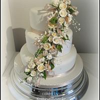 cascading ivory and champagne roses