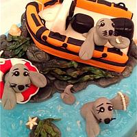 Seals, boat and puppies cake with jewellery cupcakes
