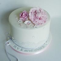 Peony and lace wedding cake and cupcakes