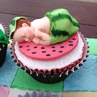 Cupcake babies on a quilted blanket